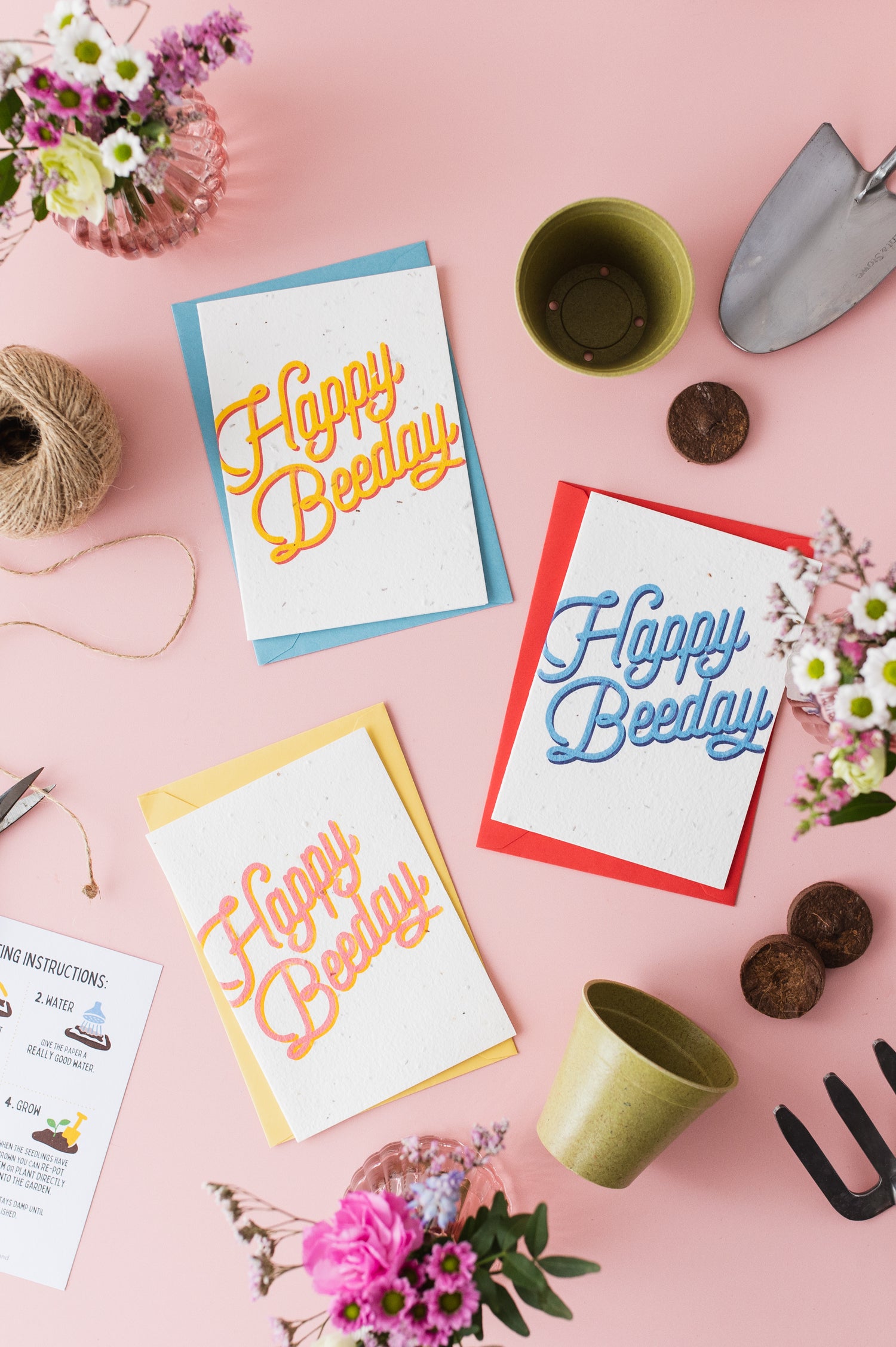 a variety of plantable birthday cards by ruby &amp; bo arranged on a pale pink background