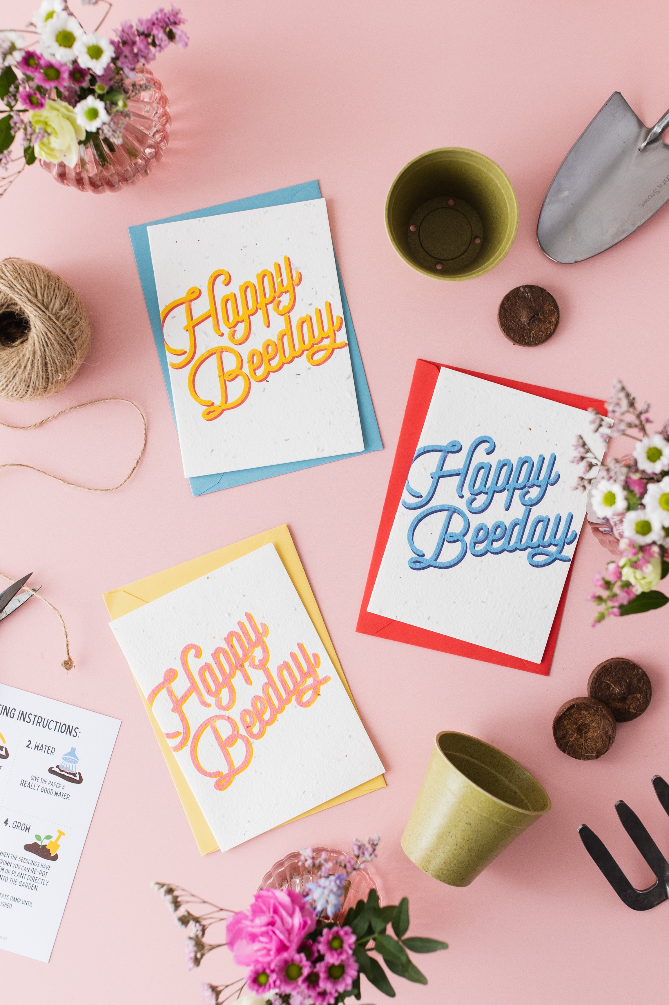 a variety of plantable birthday cards by ruby & bo arranged on a pale pink background