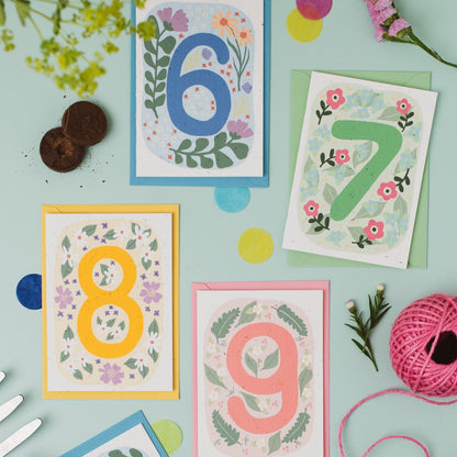 A selection of four Ruby &amp; Bo plantable age cards on a mint green background